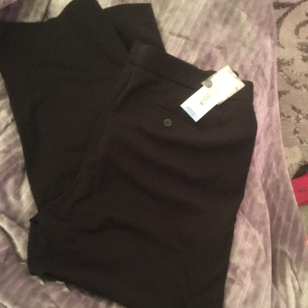 Black woman’s long length dress pants.
